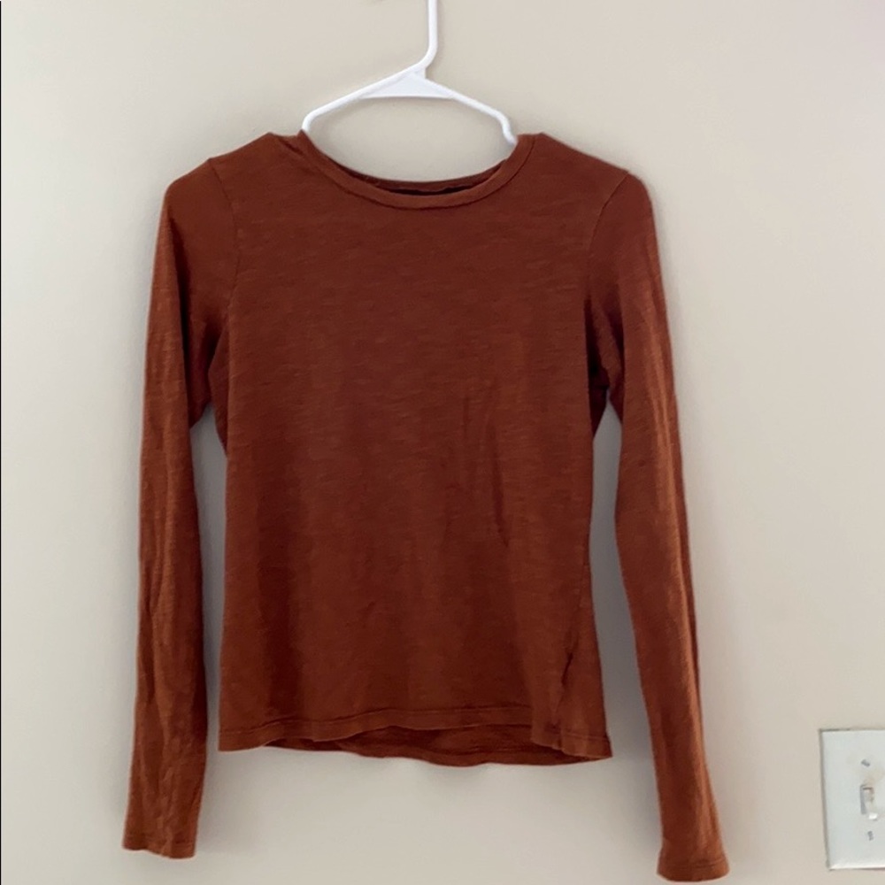 orangeish/brownish long sleeve shirt